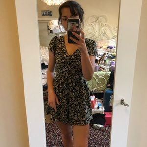 Black floral romper with laced up back.